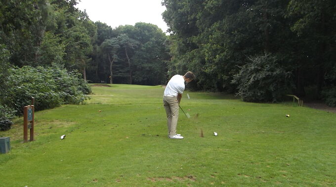 Ben Jones tees off at the short 9th hole at Royal Norwich